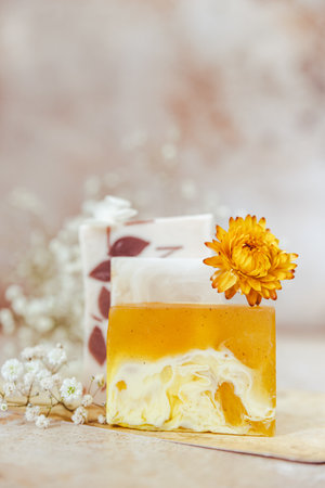 Natural organic soap bars. Homemade cosmetics, eco-friendly spa, beauty skincare concept. Small business, ethical shopping idea. Pastel minimal composition. Beige background.の写真素材