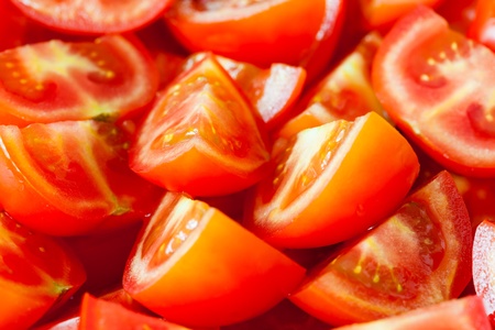 a lot of juicy sliced tomatoes (macro shot)の写真素材