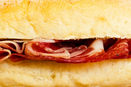 a delicious sandwich filled with italian salami (coppa di parma)の写真素材