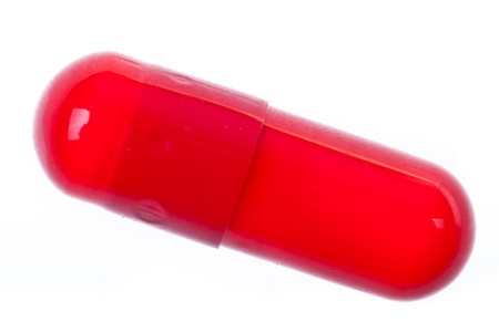 Extreme macro of a single pill over white backgroundの写真素材