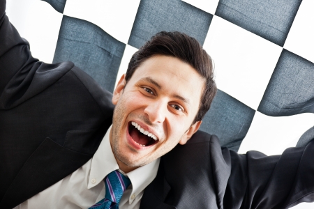 A Young Businessman on a checkered backgroundの写真素材
