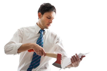 a young Businessman with hatchet looking at some documentsの写真素材