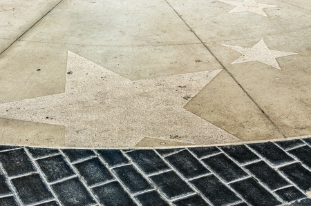 the paving of a walkway in hollywood with stars engraved in the tiles