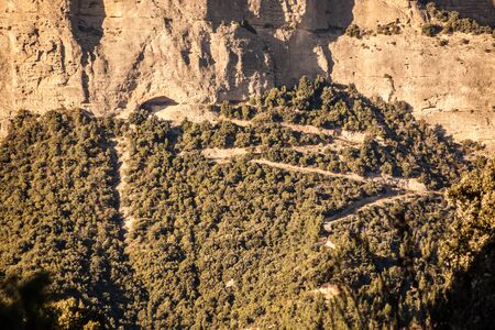 a small path carved in the mountain heading to an abandoned quarry