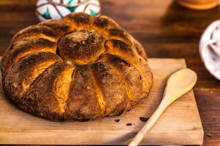 a homemade bread loaf on a wooden cutting board