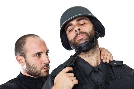 an evil villain threatening a swat officer with a gunの写真素材