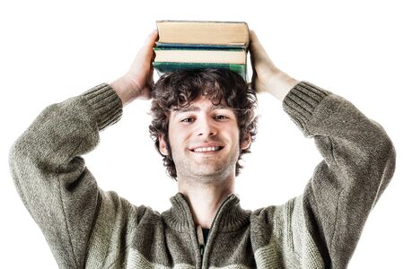 an handsome student with some books isolated over a white backgroundの写真素材