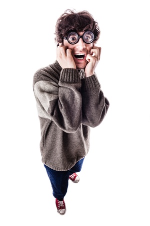 an handsome guy, maybe a student, in casual clothing with thick glasses and a nerdy look. isolated on whiteの写真素材