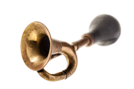 an old manual air horn isolated over a white background