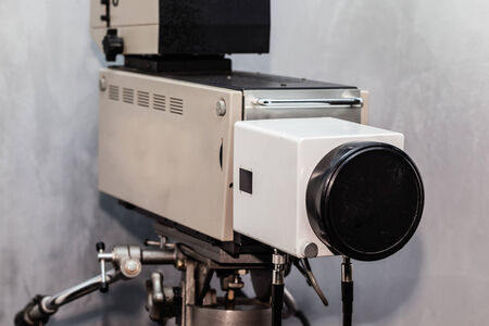 an obsolete analog tv studio camera on a tripod
