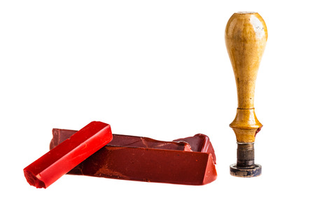 red sealing wax sticks, a wooden seal and an envelope isolated over a white backgroundの写真素材