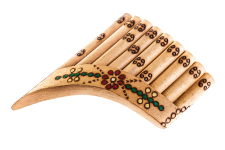 a wooden pan flute isolated over a white background