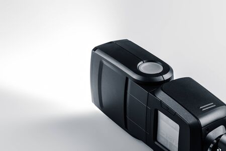 an electronic camera flash on a white background