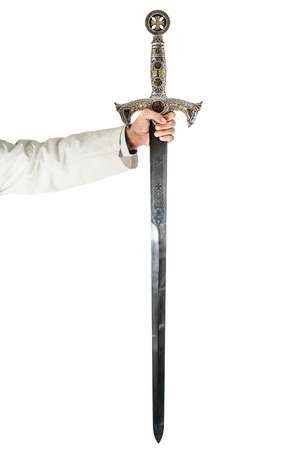 a hand holding a long and ornated medieval steel swordの写真素材