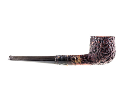 an old tobacco pipe isolated over a white background