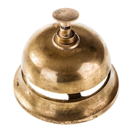 an old hotel bell isolated over a white backgroundの写真素材