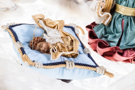 a very elegant crib with baby jesus, the virgin Mary, St. Joseph and two angelsの写真素材