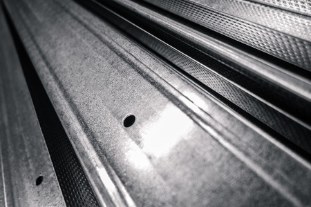 some steel or aluminum rods with a shallow depth of fieldの写真素材