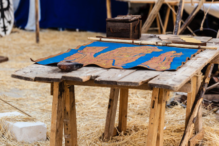 an ancient geographical military map on a wooden tableの写真素材
