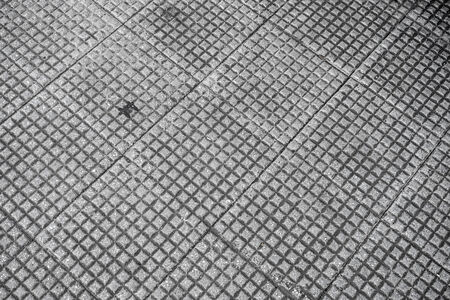 close up of a dirty paving id a pedestrian walkway