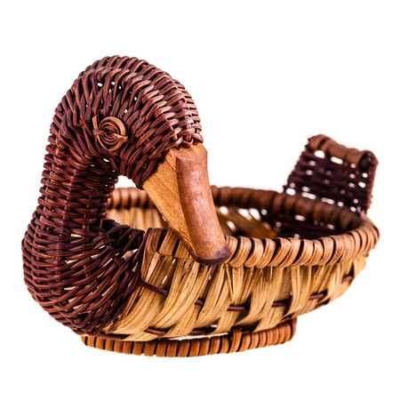 a duck shaped vimini basket isolated over a white の写真素材