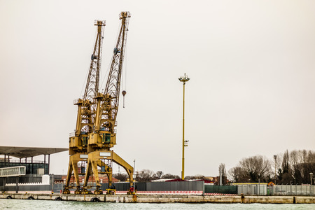 Port cargo crane over sky in Venice