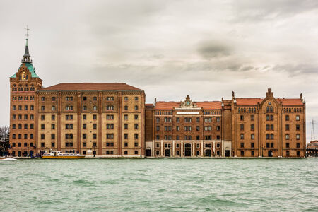 VENICE- MARCH 14:At the west corner of the Giudecca, Molino Stucky is an anomaly on the Venice panorama, a new gothic industrial building, nowadays a de luxe residence, on 14th March 2013 in Venice.のeditorial素材