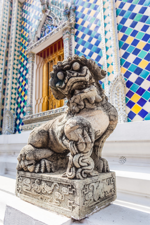 Chinese dog or lion sculpture in Wat Phra Kaew, Temple of the Emerald Buddha, Bangkok, Thailand.の写真素材