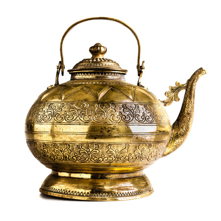 a vintage Indian or philippine teapot isolated on a white backgroundの写真素材