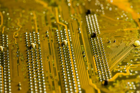 macro shot of a golden colored circuit board