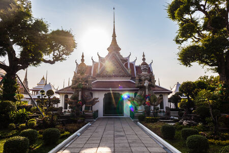 the ratchawararam in Temple of Dawn Wat Arun and a beautiful blue sky in Bangkok, Thailand