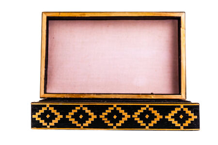 a beautiful decorated ancient bulgarian wooden box isolated over a white backgroundの写真素材