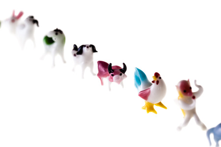 small glass sculptures representing the chinese zodiac signs isolated over a pure white backgroundの写真素材