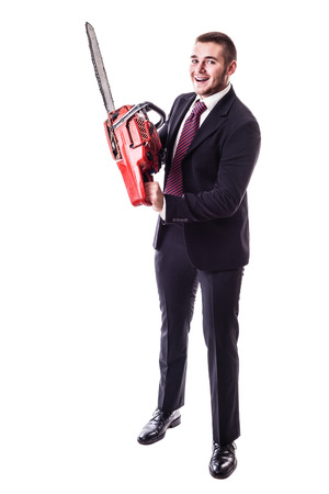 a young businessman holding a red chainsaw isolated over a white backgroundの写真素材