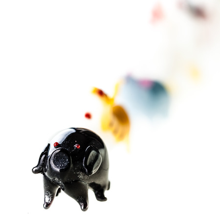 small glass sculptures representing the chinese zodiac signs isolated over a pure white backgroundの写真素材