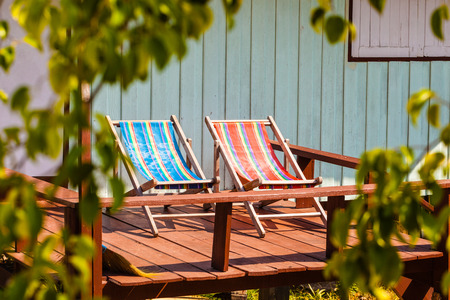 two colorful deckchairs in a thai tropical resort