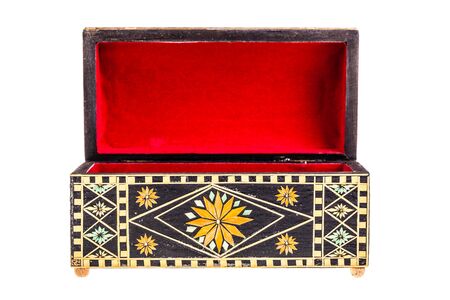 a beautiful decorated ancient bulgarian wooden box isolated over a white backgroundの写真素材