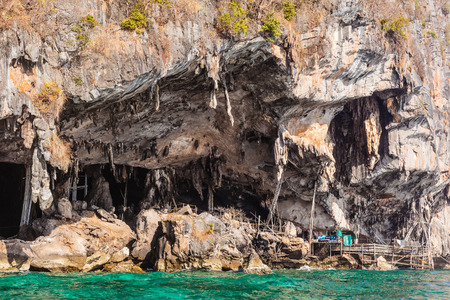 A wooden pier at the Viking cave, on the shore of Maya Island, part of Phi Phi islands in Andaman...