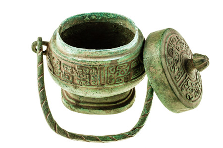 a corroded ancient chinese container isolated over a white backgroundの写真素材