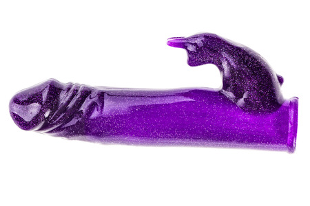 a realistic looking purple rubber phallic dildo isolated over a white background