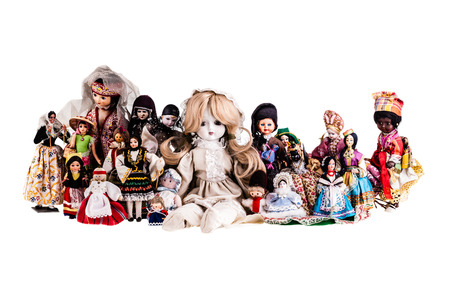 a beautiful vintage dolls collection isolated over a white backgroundの写真素材