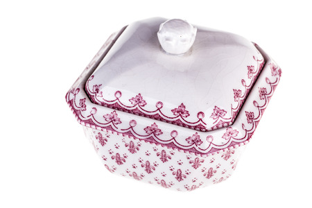 a decorated white porcelain sugar bowl isolated over a white backgroundの写真素材