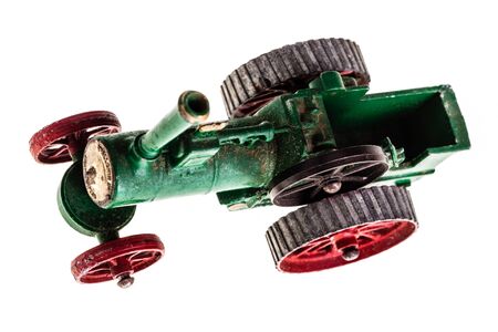 a metal model of a steam tractor isolated over a white backgroundの写真素材