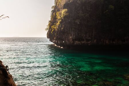 the beautiful Maya Bay in Thailand with tropical pristine sea and a small rocky isletの写真素材