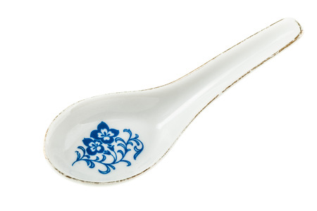 a chinese ceramic soup spoon isolated over a white backgroundの写真素材