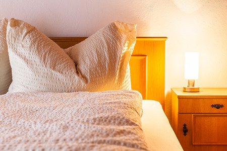 a cozy bed and breakfast or hotel bedroom in Austriaの写真素材