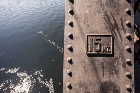 a strong riveted steel beams structure of a railway bridgeの写真素材