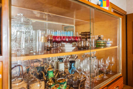 fine glassware including glasses and tea cups in a cabinetの写真素材