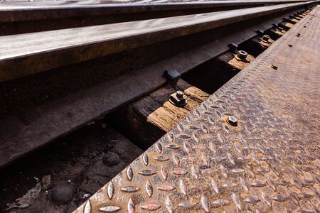 vintage railroad tracks of the famous bridge on the river Kwai in Thailandの写真素材