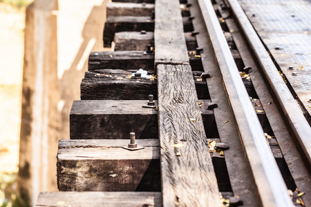 vintage railroad tracks of the famous bridge on the river Kwai in Thailandの写真素材